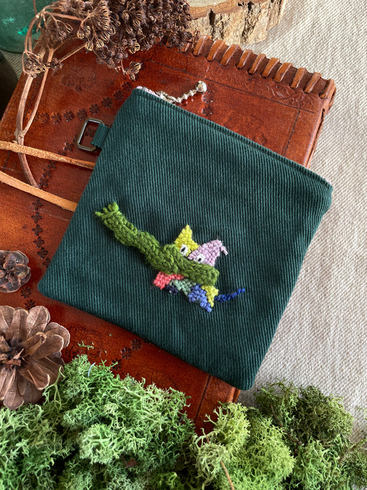 Sasha and his scarf green pouch