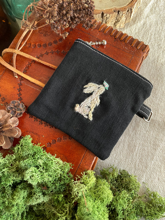 Nell with a butterfly zipper pouch