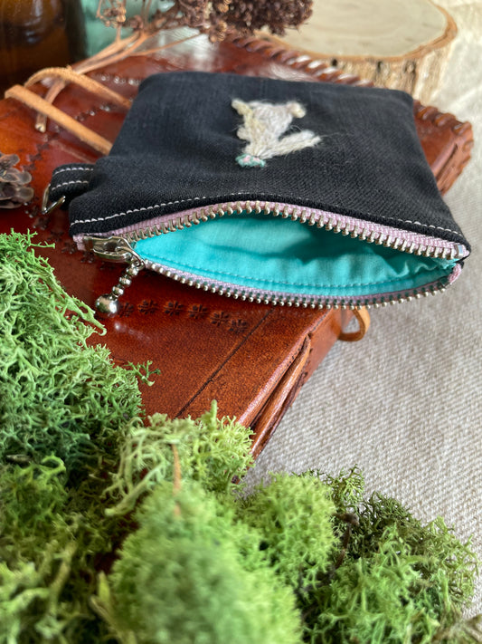 Nell with a butterfly zipper pouch