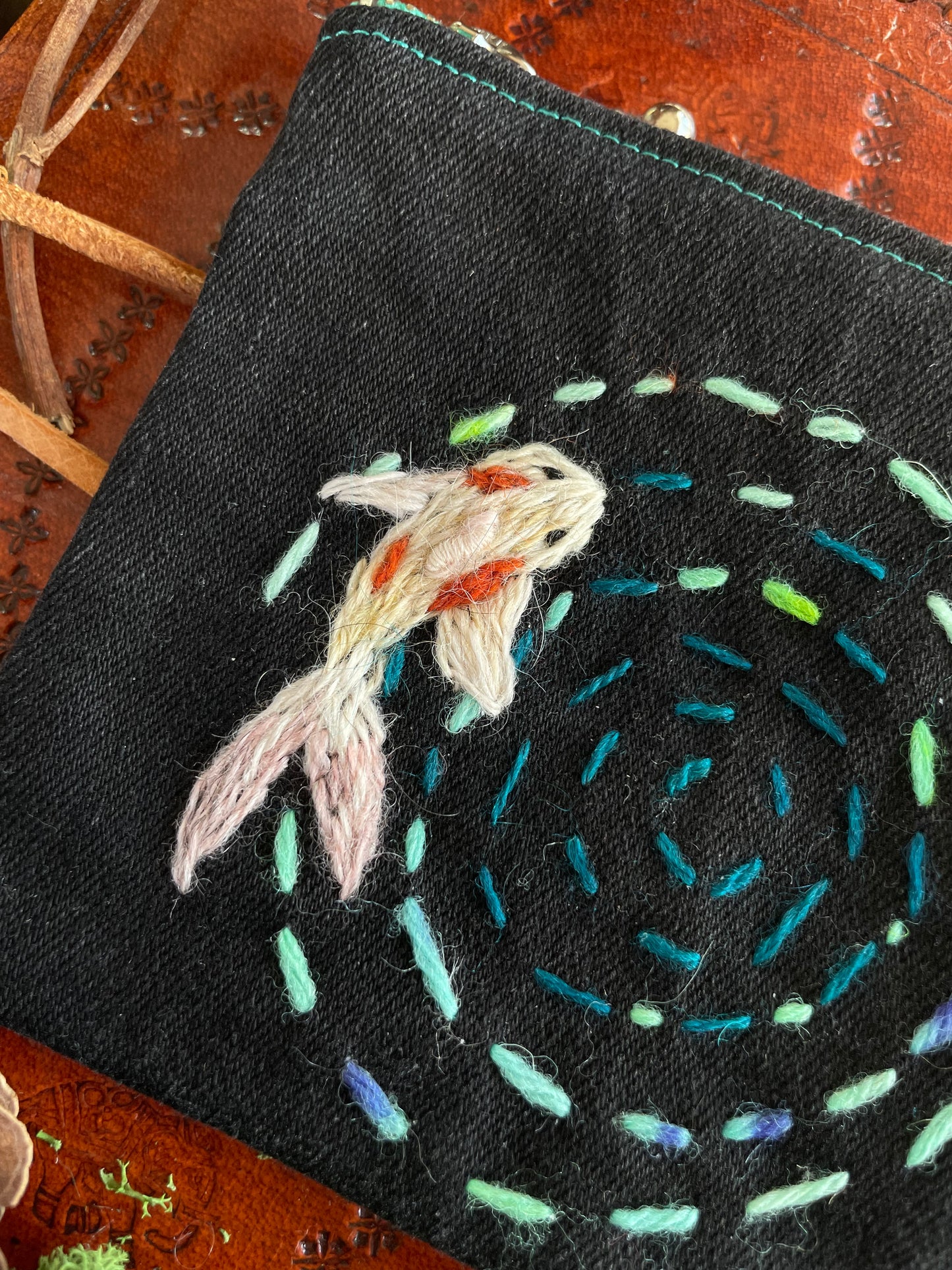 Koi pond ripples on the water zipper pouch